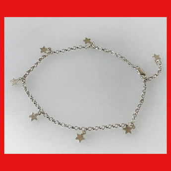 A sterling silver anklet with a chain design and star dangles