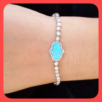 Bracelets; Sterling silver tennis and Opal hand of Fatima