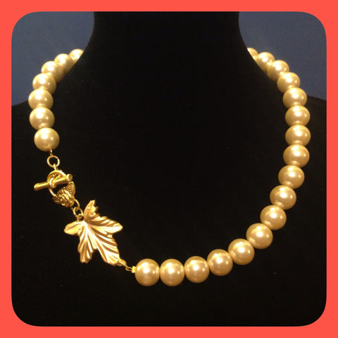 Necklace; pearl and gold plated leaf