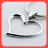 Pendants; Sterling silver asymmetrical open floating heart